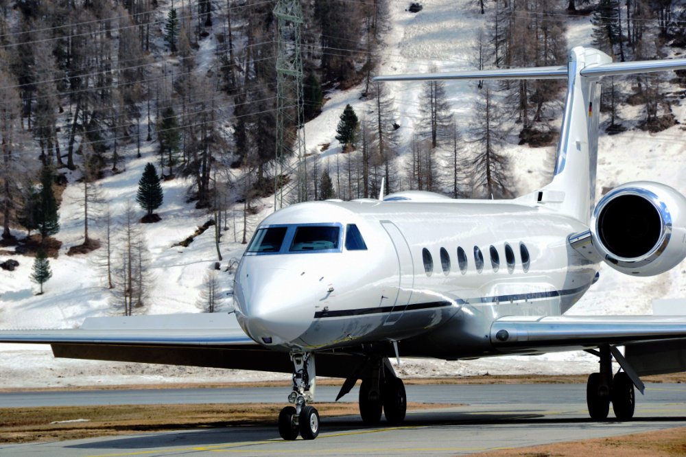 Private jet at snowy mountain airport